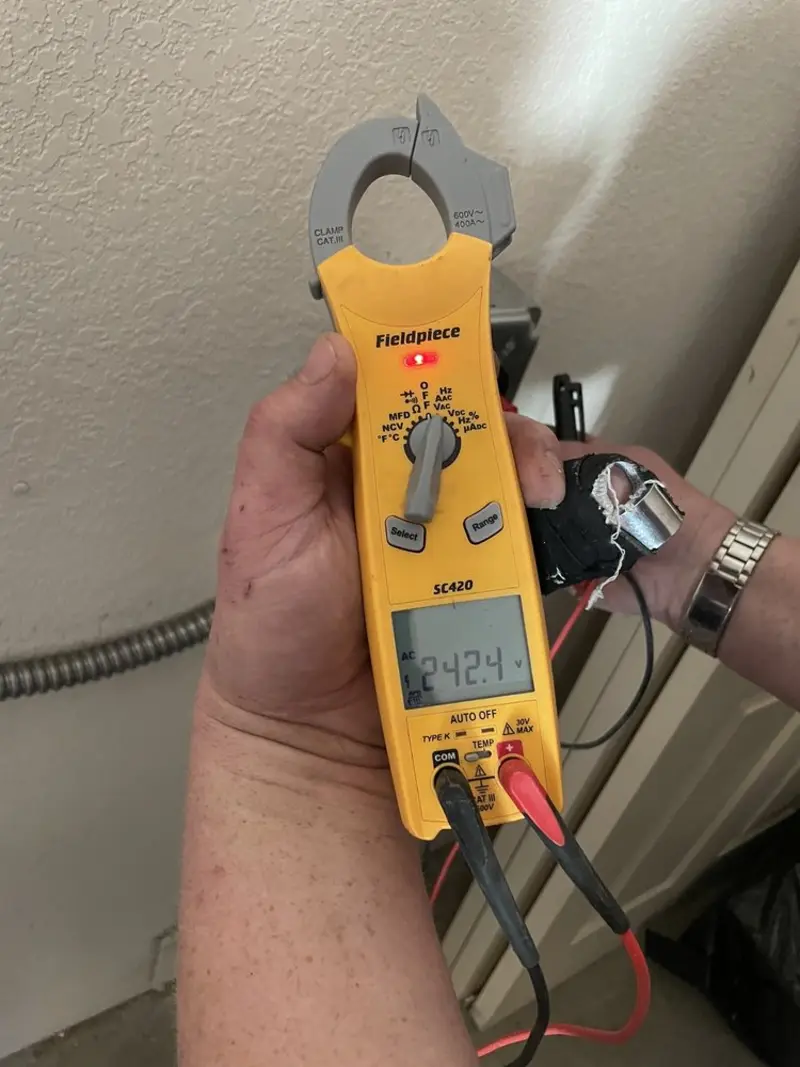 Voltage testing with clamp meter during Aluminum Wiring Replacement in Colby